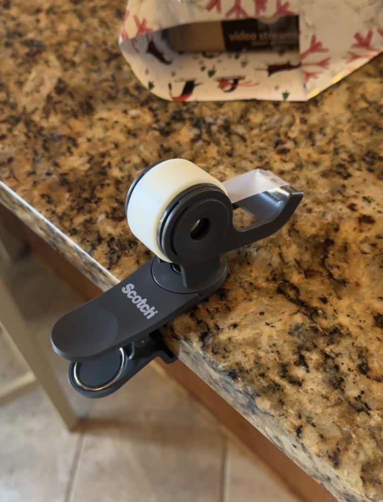 Clip on tape dispenser